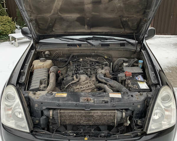 Черный Cанг Йонг Рекстон, объемом двигателя 2.7 л и пробегом 232 тыс. км за 6600 $, фото 10 на Automoto.ua