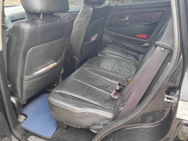 Черный Cанг Йонг Рекстон, объемом двигателя 2.7 л и пробегом 320 тыс. км за 7300 $, фото 3 на Automoto.ua