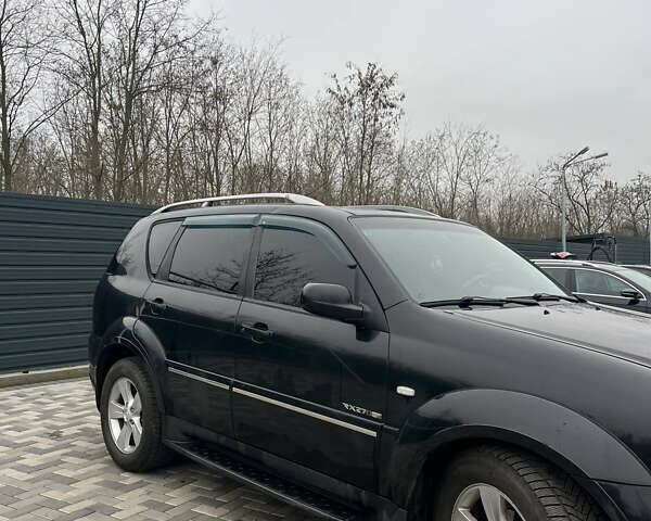 Черный Cанг Йонг Рекстон, объемом двигателя 2.7 л и пробегом 318 тыс. км за 8700 $, фото 2 на Automoto.ua