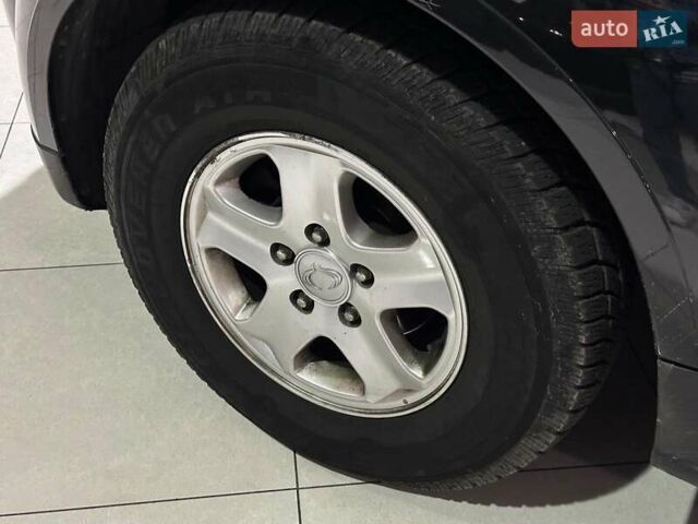 Черный Cанг Йонг Рекстон, объемом двигателя 2.7 л и пробегом 63 тыс. км за 11440 $, фото 6 на Automoto.ua