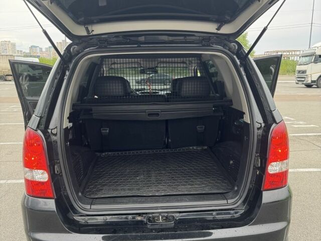 Черный Cанг Йонг Рекстон, объемом двигателя 2.7 л и пробегом 247 тыс. км за 10000 $, фото 15 на Automoto.ua