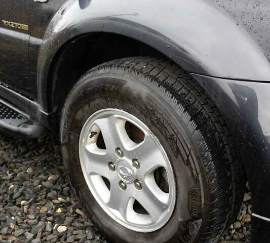 Чорний Cанг Йонг Rexton, об'ємом двигуна 2.7 л та пробігом 123 тис. км за 9000 $, фото 12 на Automoto.ua