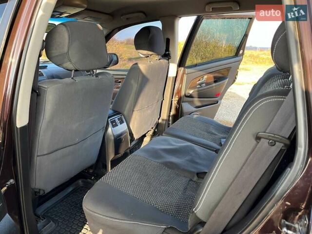 Коричневий Cанг Йонг Rexton, об'ємом двигуна 2.7 л та пробігом 113 тис. км за 9500 $, фото 6 на Automoto.ua