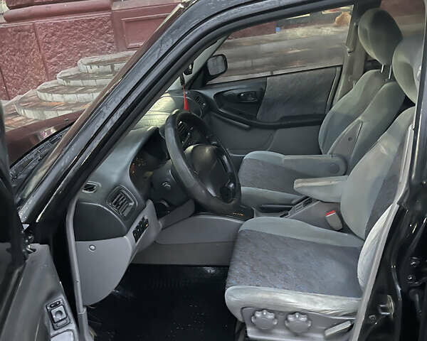 Черный Субару Форестер, объемом двигателя 1.99 л и пробегом 360 тыс. км за 2950 $, фото 9 на Automoto.ua