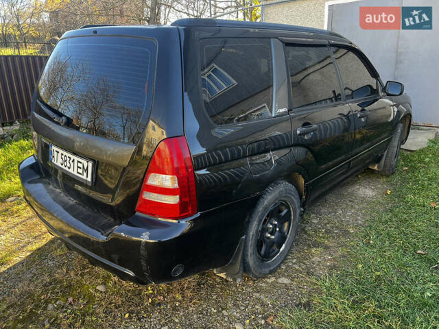 Черный Субару Форестер, объемом двигателя 1.99 л и пробегом 350 тыс. км за 4999 $, фото 5 на Automoto.ua