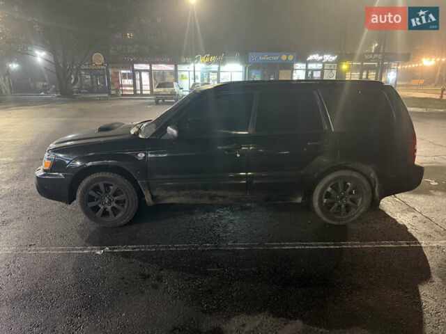 Черный Субару Форестер, объемом двигателя 2 л и пробегом 296 тыс. км за 5600 $, фото 2 на Automoto.ua