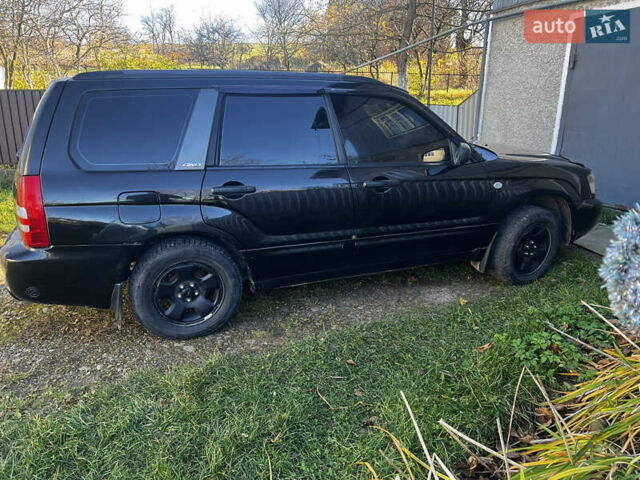 Черный Субару Форестер, объемом двигателя 1.99 л и пробегом 350 тыс. км за 4999 $, фото 4 на Automoto.ua