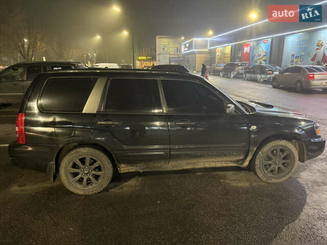 Черный Субару Форестер, объемом двигателя 2 л и пробегом 296 тыс. км за 5600 $, фото 4 на Automoto.ua