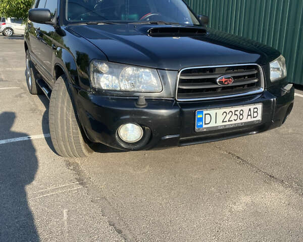 Черный Субару Форестер, объемом двигателя 1.99 л и пробегом 290 тыс. км за 6100 $, фото 7 на Automoto.ua