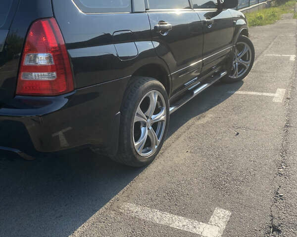 Черный Субару Форестер, объемом двигателя 1.99 л и пробегом 290 тыс. км за 6100 $, фото 5 на Automoto.ua