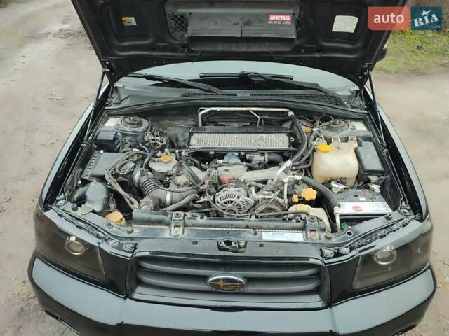 Черный Субару Форестер, объемом двигателя 1.99 л и пробегом 440 тыс. км за 5200 $, фото 11 на Automoto.ua
