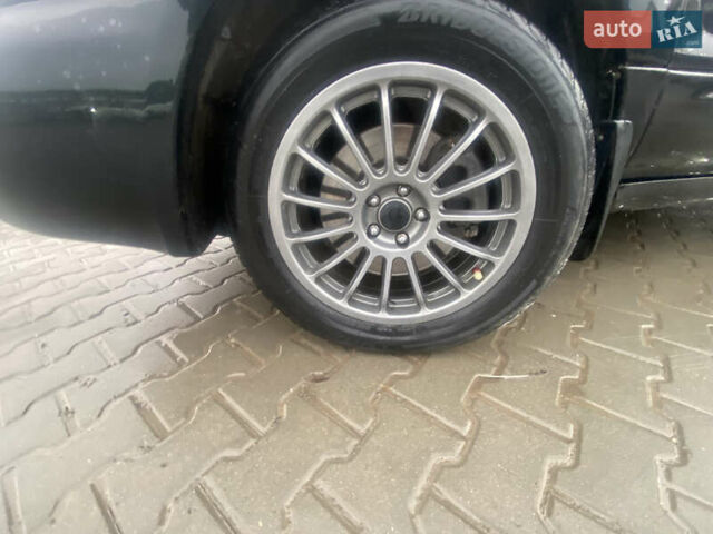 Чорний Субару Forester, об'ємом двигуна 2 л та пробігом 260 тис. км за 6999 $, фото 4 на Automoto.ua