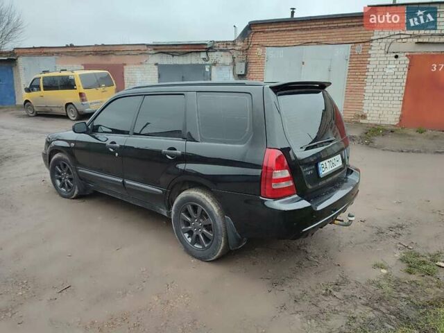 Черный Субару Форестер, объемом двигателя 1.99 л и пробегом 440 тыс. км за 5200 $, фото 6 на Automoto.ua