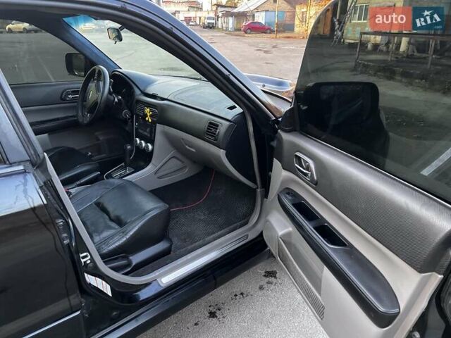 Черный Субару Форестер, объемом двигателя 2.5 л и пробегом 235 тыс. км за 5650 $, фото 6 на Automoto.ua