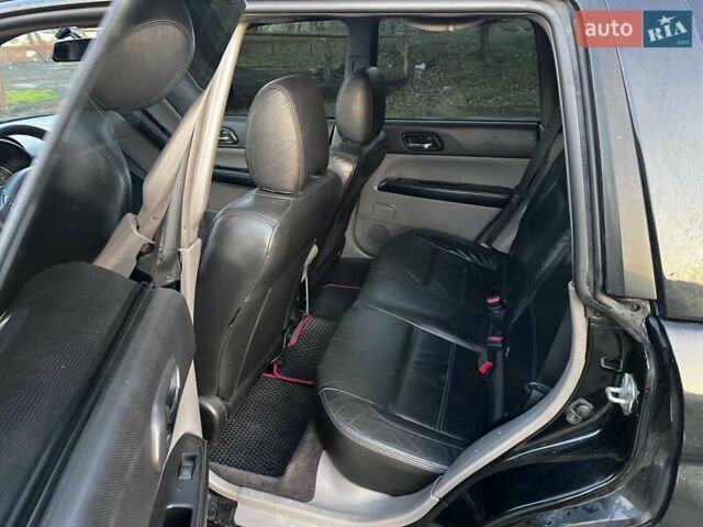 Черный Субару Форестер, объемом двигателя 2.5 л и пробегом 235 тыс. км за 5650 $, фото 3 на Automoto.ua