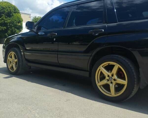 Черный Субару Форестер, объемом двигателя 1.99 л и пробегом 270 тыс. км за 7100 $, фото 3 на Automoto.ua