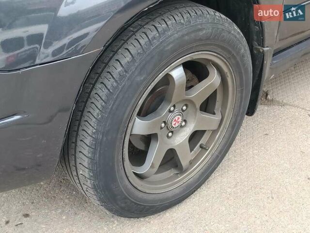 Серый Субару Форестер, объемом двигателя 2 л и пробегом 291 тыс. км за 5690 $, фото 2 на Automoto.ua