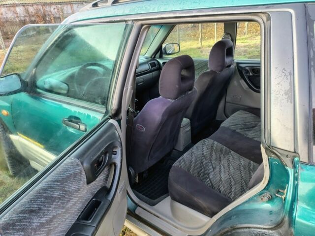 Зелений Субару Forester, об'ємом двигуна 2 л та пробігом 350 тис. км за 1736 $, фото 7 на Automoto.ua