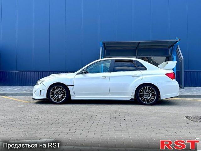 Белый Субару Импреза, объемом двигателя 2.5 л и пробегом 142 тыс. км за 16000 $, фото 1 на Automoto.ua