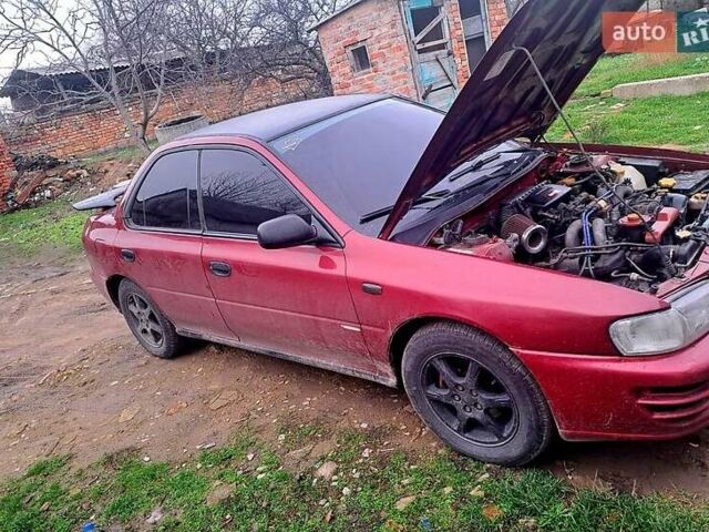 Красный Субару Импреза, объемом двигателя 1.6 л и пробегом 150 тыс. км за 2600 $, фото 1 на Automoto.ua
