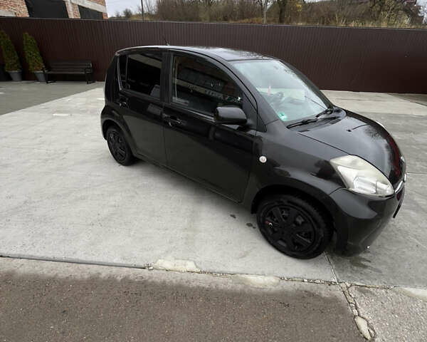 Черный Субару Джасти, объемом двигателя 1 л и пробегом 182 тыс. км за 3999 $, фото 2 на Automoto.ua