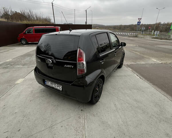 Черный Субару Джасти, объемом двигателя 1 л и пробегом 182 тыс. км за 3999 $, фото 3 на Automoto.ua