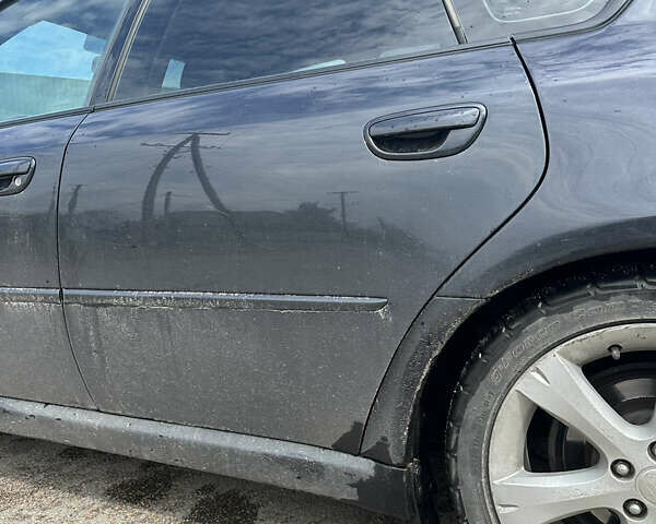 Черный Субару Легаси, объемом двигателя 2.46 л и пробегом 285 тыс. км за 5200 $, фото 5 на Automoto.ua