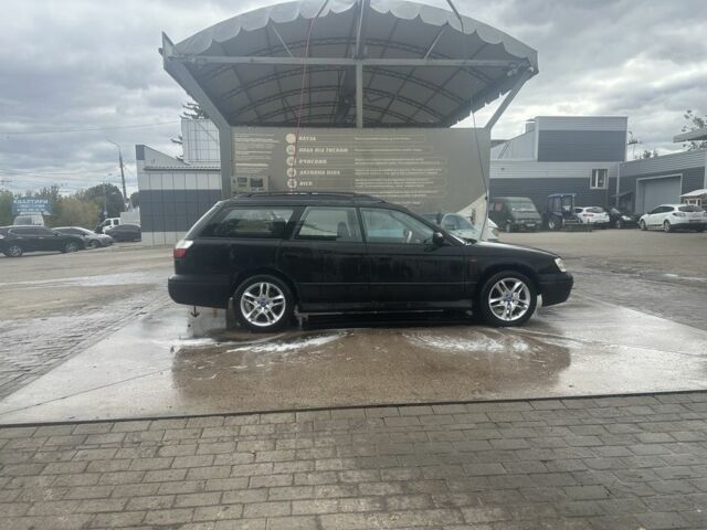 Черный Субару Легаси, объемом двигателя 2.5 л и пробегом 180 тыс. км за 2738 $, фото 3 на Automoto.ua