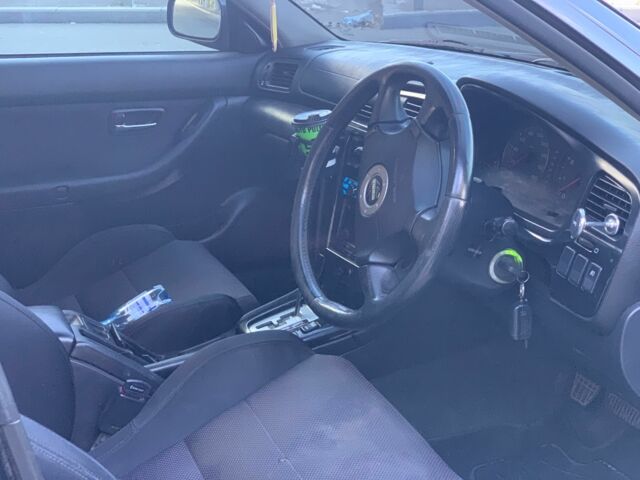 Черный Субару Легаси, объемом двигателя 2.5 л и пробегом 145 тыс. км за 4200 $, фото 1 на Automoto.ua