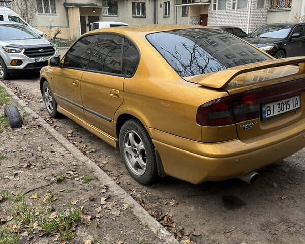 Желтый Субару Легаси, объемом двигателя 2.46 л и пробегом 345 тыс. км за 4100 $, фото 7 на Automoto.ua