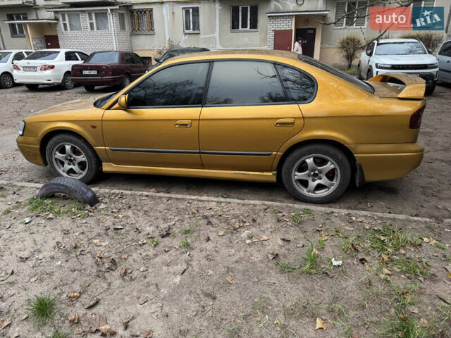 Желтый Субару Легаси, объемом двигателя 2.46 л и пробегом 345 тыс. км за 4100 $, фото 8 на Automoto.ua