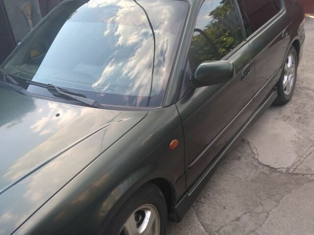 Зеленый Субару Легаси, объемом двигателя 2.5 л и пробегом 245 тыс. км за 3000 $, фото 4 на Automoto.ua