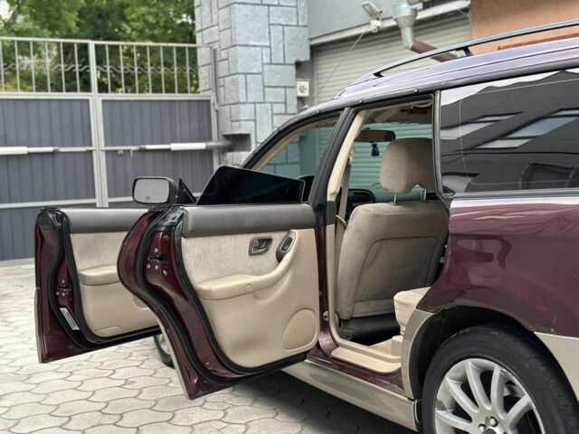 Красный Субару Аутбек, объемом двигателя 2.5 л и пробегом 2 тыс. км за 4300 $, фото 5 на Automoto.ua