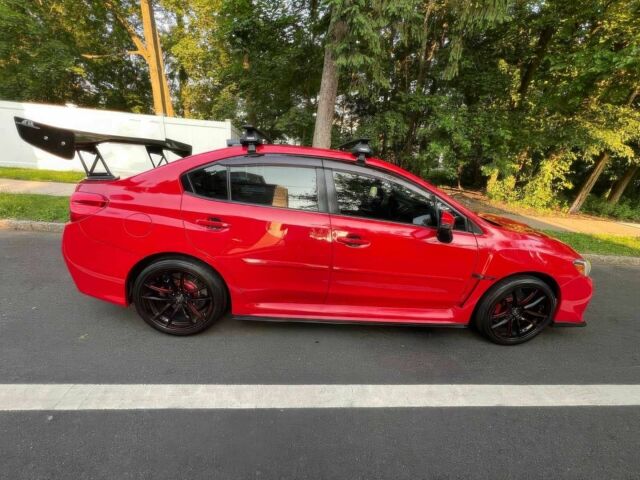 Красный Субару Impreza WRX, объемом двигателя 2.5 л и пробегом 89 тыс. км за 11500 $, фото 2 на Automoto.ua