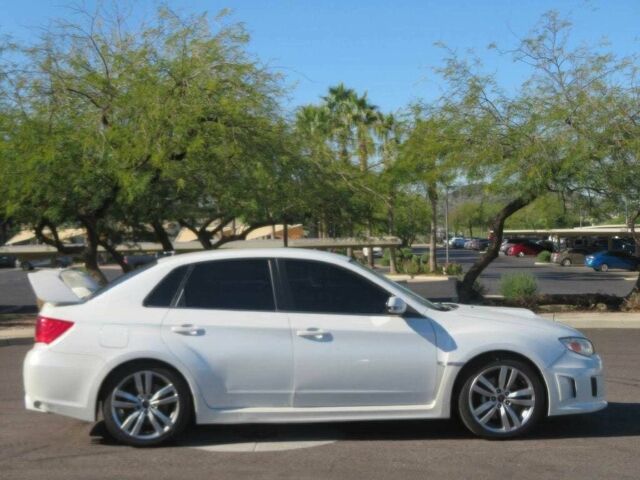 Белый Субару Импреза ВРХ СТИ, объемом двигателя 2.5 л и пробегом 81 тыс. км за 7600 $, фото 2 на Automoto.ua