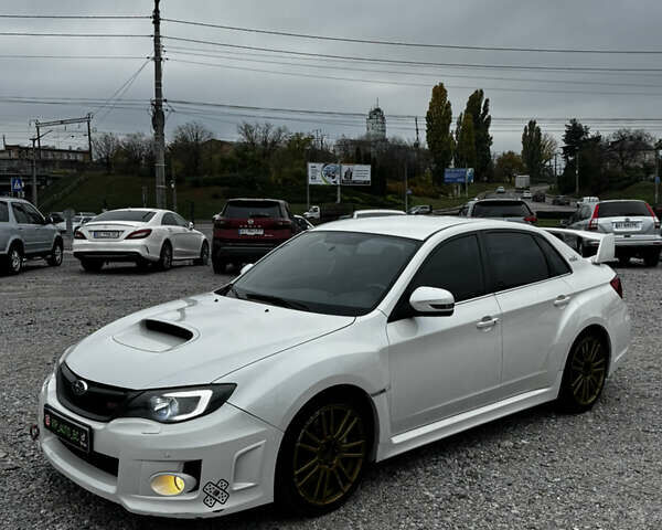 Субару WRX STI 2014 в Белой Церкве на Automoto.ua Белый Субару WRX STI, объемом двигателя 2.46 л и пробегом 68 тыс. км за 18500 $, фото 1 на Automoto.ua