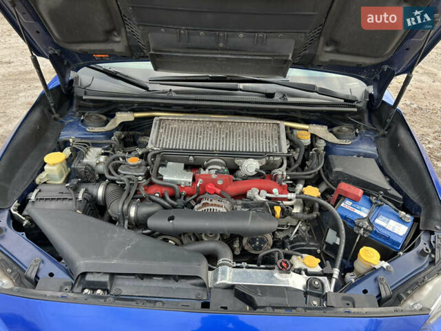 Синий Субару WRX STI, объемом двигателя 2.46 л и пробегом 127 тыс. км за 25000 $, фото 9 на Automoto.ua