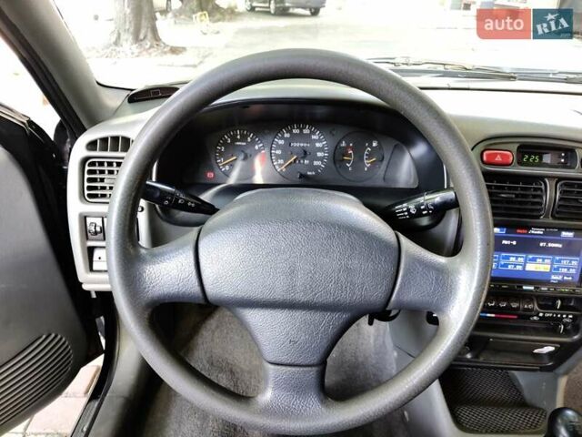 Черный Сузуки Балеро, объемом двигателя 1.3 л и пробегом 332 тыс. км за 2800 $, фото 3 на Automoto.ua