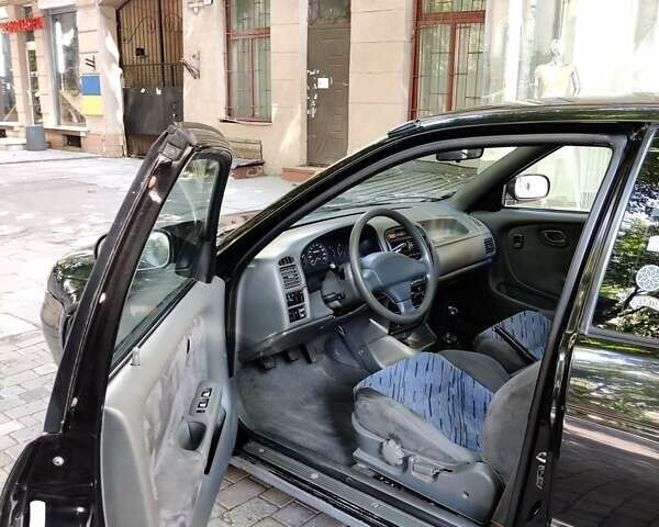 Черный Сузуки Балеро, объемом двигателя 1.3 л и пробегом 332 тыс. км за 2800 $, фото 4 на Automoto.ua