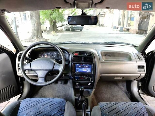 Черный Сузуки Балеро, объемом двигателя 1.3 л и пробегом 332 тыс. км за 2800 $, фото 1 на Automoto.ua