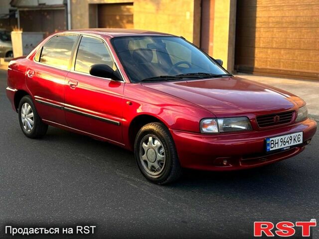 Красный Сузуки Балеро, объемом двигателя 1.6 л и пробегом 200 тыс. км за 2100 $, фото 1 на Automoto.ua