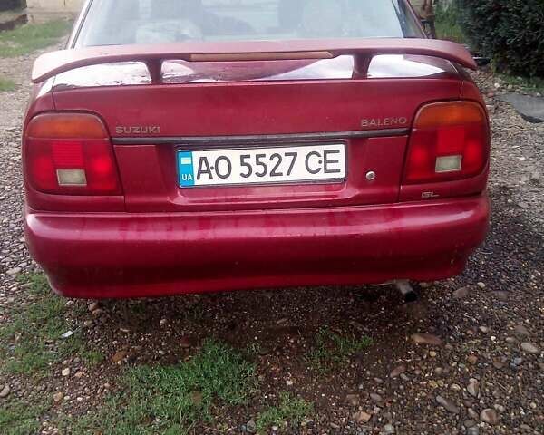 Красный Сузуки Балеро, объемом двигателя 1.3 л и пробегом 174 тыс. км за 1550 $, фото 3 на Automoto.ua