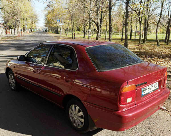 Красный Сузуки Балеро, объемом двигателя 1.6 л и пробегом 378 тыс. км за 1550 $, фото 2 на Automoto.ua
