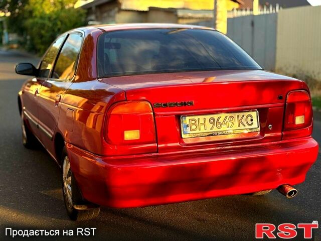 Красный Сузуки Балеро, объемом двигателя 1.6 л и пробегом 200 тыс. км за 2100 $, фото 3 на Automoto.ua