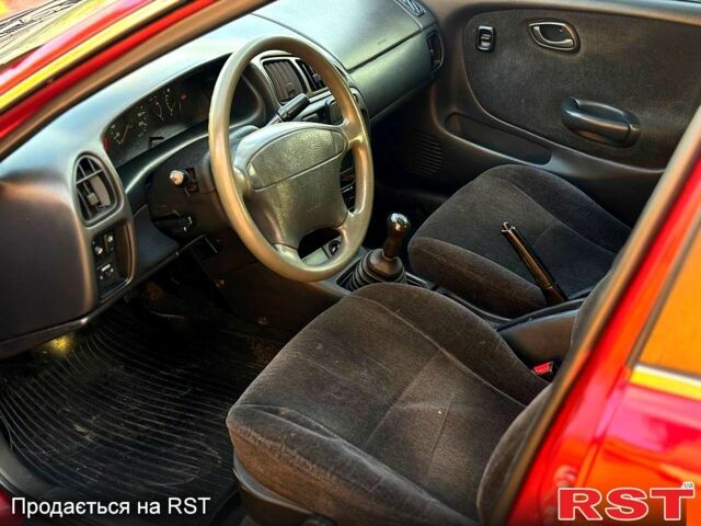 Красный Сузуки Балеро, объемом двигателя 1.6 л и пробегом 200 тыс. км за 2100 $, фото 5 на Automoto.ua