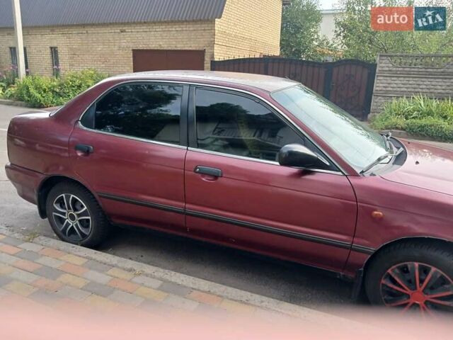 Красный Сузуки Балеро, объемом двигателя 1.59 л и пробегом 320 тыс. км за 2100 $, фото 2 на Automoto.ua