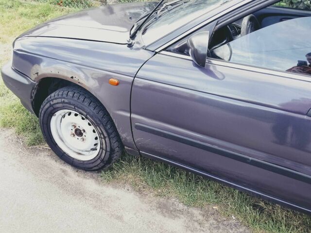 Серый Сузуки Балеро, объемом двигателя 1.3 л и пробегом 387 тыс. км за 1000 $, фото 8 на Automoto.ua