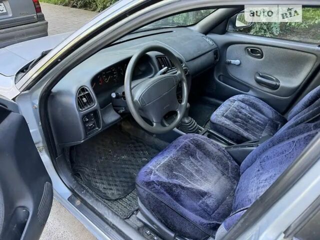 Серый Сузуки Балеро, объемом двигателя 1.3 л и пробегом 200 тыс. км за 1199 $, фото 5 на Automoto.ua