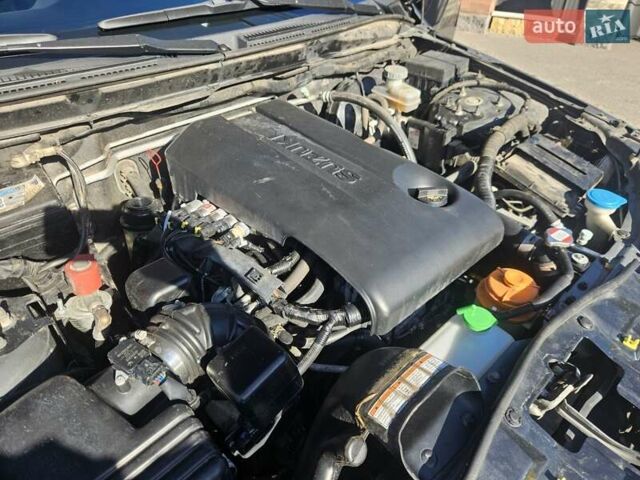 Черный Сузуки Гранд Витара, объемом двигателя 2.4 л и пробегом 175 тыс. км за 11500 $, фото 14 на Automoto.ua