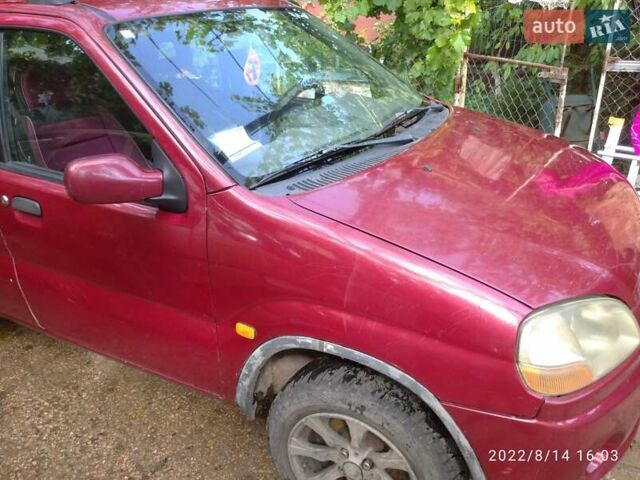 Красный Сузуки Игнис, объемом двигателя 1.33 л и пробегом 320 тыс. км за 1900 $, фото 3 на Automoto.ua